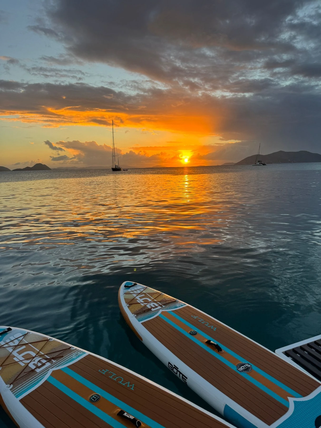 Paddleboards on the water at sunset in the BVI